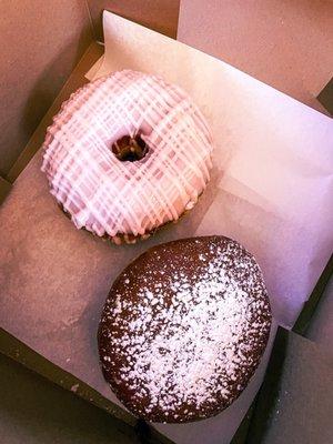 Strawberry-iced and raspberry-filled doughnuts. (Not pictured: the vanilla-iced one we ate on the way home)