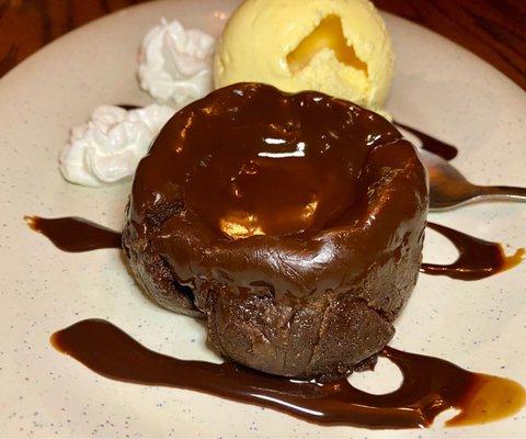 Finish off the meal with a chocolate lava cake complete with vanilla ice cream and chocolate sauce.