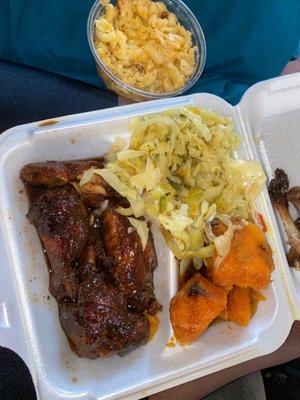 Jerk BBQ wings, cabbage, and candied yams with a side of Mac & cheese