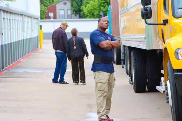 Storage area loading a container to depart over seas. Great crew!