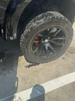 We went through the car wash and it left all this black liquid stuff on it.