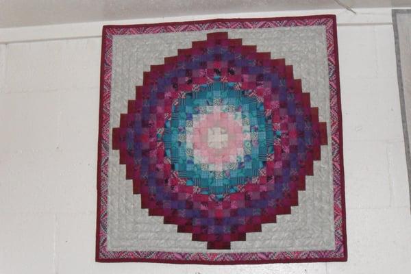 Willow Creek Cafe & Store - "Log Cabin in the Round: quilts on walls inside by owner Bev Vickery