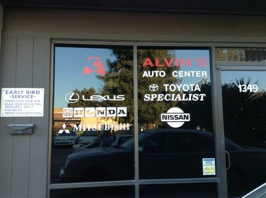 Alvin's auto center front window showing what cars they can fix