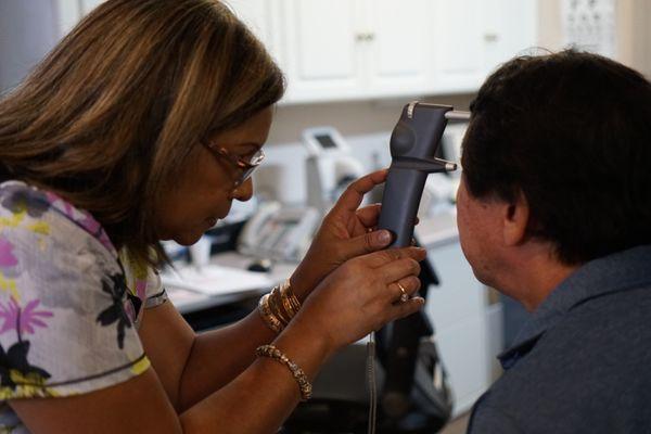 Paulette is using our icare instrument to check the eye pressures.  No more "air-puffs"!!