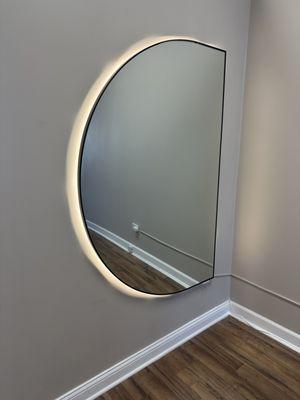 A beautiful glowing mirror to check out your baby bump and show your glow