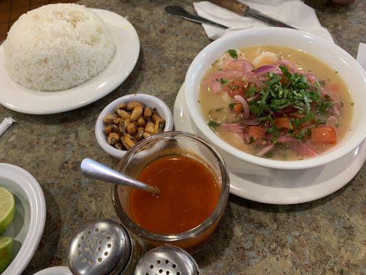 Shrimp Ceviche, hot sauce, cancha corn nuts (maiz tostado) and rice.