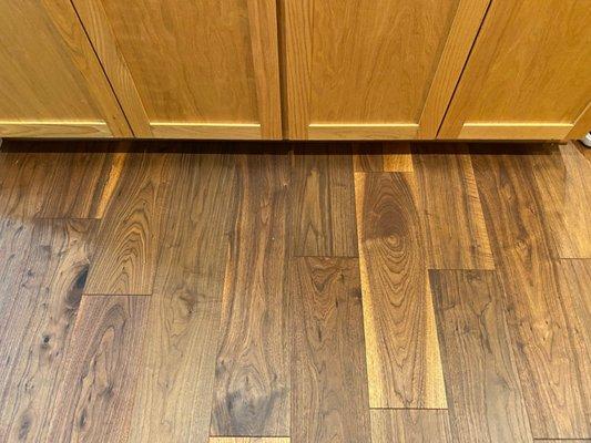 Walnut hardwood floor and honey oak cabinets