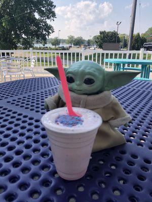 Baby Yoda enjoying cotton candy scramble