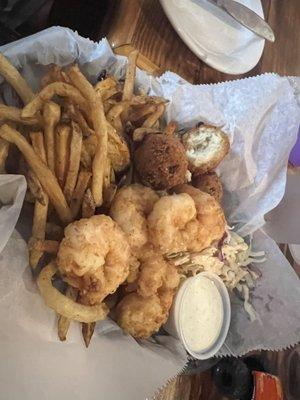 Light breading on the shrimp - which is how I like it. Fries were kinda cold and the slaw was bland. $18