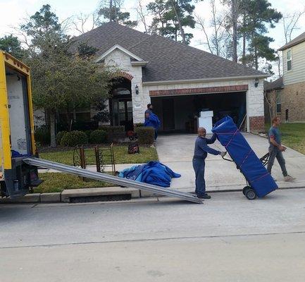 Lewis,Tom, and Anthony Unloading a 3 bedroom home in West Lake Houston. Have to love the enthusiasm on Tom's face :) camera shy