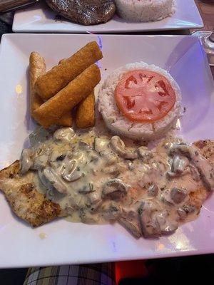 Chicken with mushrooms, rice, and fried yuca