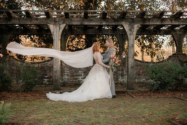 Bride and Groom autumn wedding pergola veil flying eclectic Gothic wedding