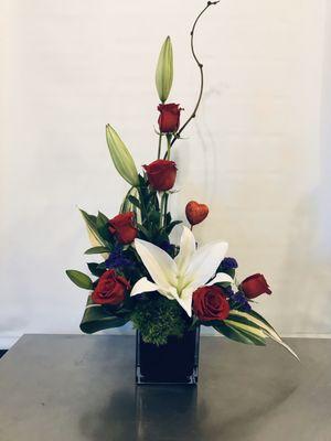 Lilies and red roses are stunning together!