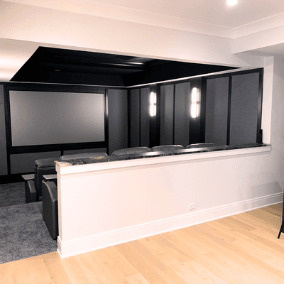 We built a custom home theater for a Newgard client, featuring an open design with 7 in-wall speakers, 2 subwoofers, and a laser projector.