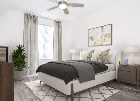 The bedroom with a LED ceiling fan and wood-look flooring at Camden Central apartments in St. Petersburg, Florida.