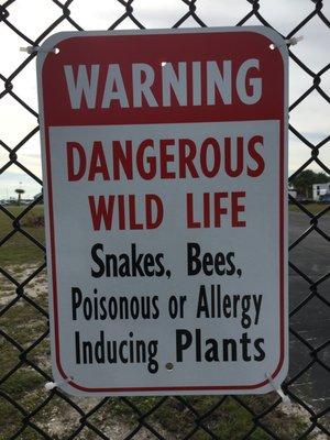 Sign posted on perimeter fence of this marina and RV resort.