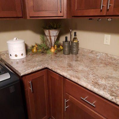 The counter top was washed and all cupboards were Murphy oil down . Very happy customer.