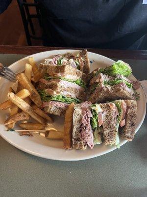 Roast beef club sandwich with fries