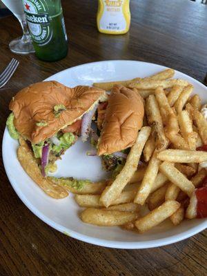 Black bean avocado burger with fries. I almost forgot to take a photo and cut it first. Your burger will not be cut in two. Lol