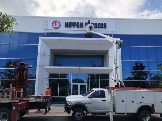 Installation of new Halo Lit Nippon Express letters with backer panel