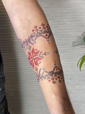 Ukrainian embroidery tattoo in support of Ukraine