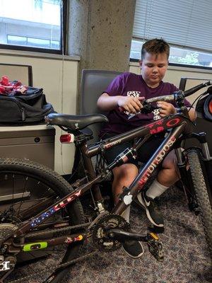 A happy dude with his bike all fixed up!