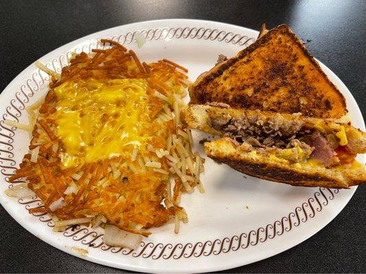 Texas bacon cheesesteak melt - smothered and covered hash browns