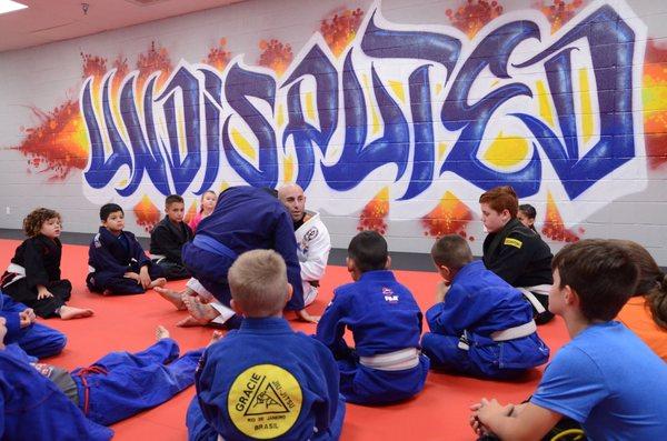 Brown Belt instructor, Coach Matt Blank, teaching another stellar youth jiu jitsu class!