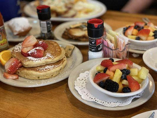 Side of pancakes and fresh fruit.