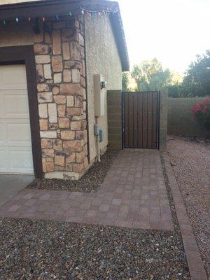 Sidewalk and replacement gate after 1 year of install still looks new