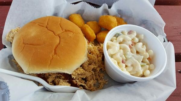 Pulled chicken sandwich, macaroni salad, and corn nuggets