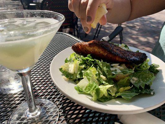 Half Caesar salad with blackened salmon and an elderflower martini