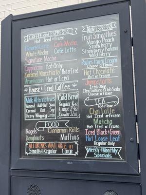 Menus from inside and outside the coffee shop alongside the breakfast items they offer.