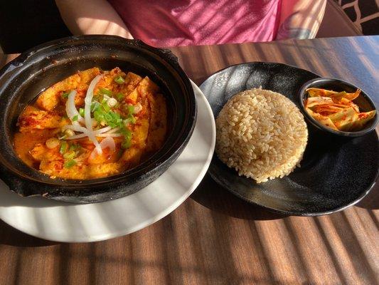 Claypot tofu stewed with house special spicy sauce, brown rice, and kimchi