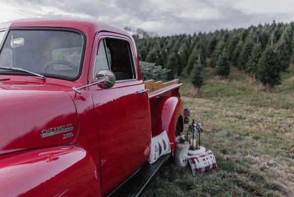 Vintage red truck setup at their farm