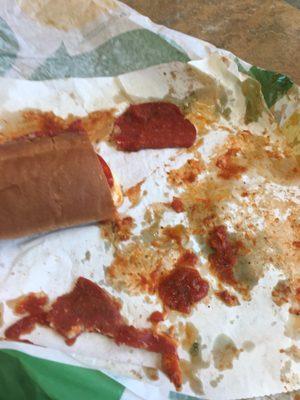 Foot long Pizza sub in Italian white bread. This was the carnage mid meal. It was the messiest sandwich I've ever ate.