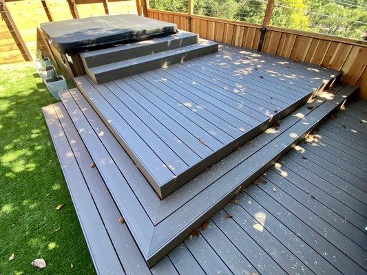 Multi-level deck with hot tub wrapped with "Azek" PVC in American Walnut