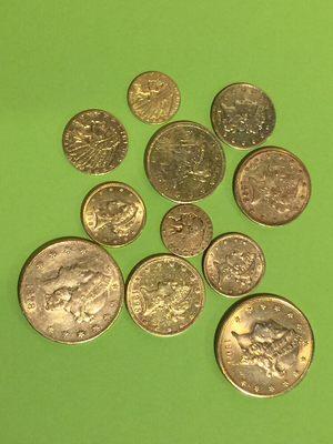 United States minted gold coins in various denominations.