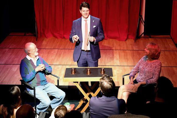 William Rader entertaining with the cups and balls.