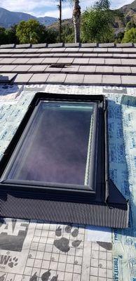 2ft x 4ft Skylight while being installed on a tile roof