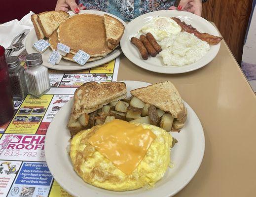 Grits, sausage, bacon, egg, pancake, white toast. Biscuit gravy, egg cheese, fried potatoes.