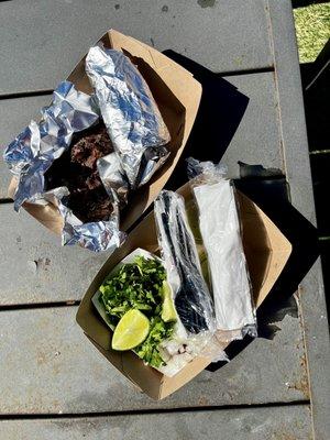 Barbacoa with the tortillas and fixings.