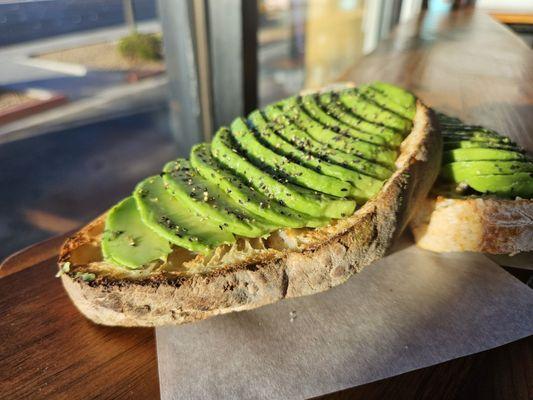 Avocado toast. Surprising filling. Beautifully played on a cheese cutting board. Simple. Delicious.