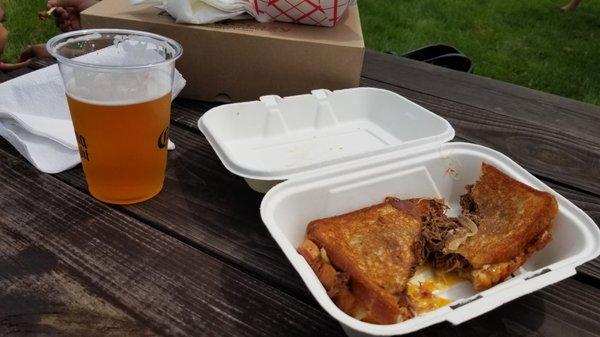 Brisket grilled cheese and a cold one from half full brewery (Peach Wheat) at the Stamford Food Truck Fest.