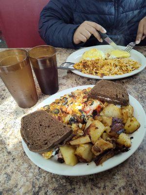 Greek omelet and 2 egg Benny