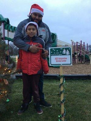 Cruz and his son visiting our tree at Prairie Park in St. John