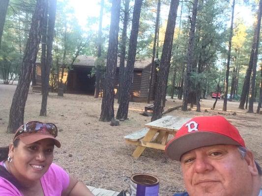 Enjoying the beautiful weather sitting out on the picnic table in front of the cabin