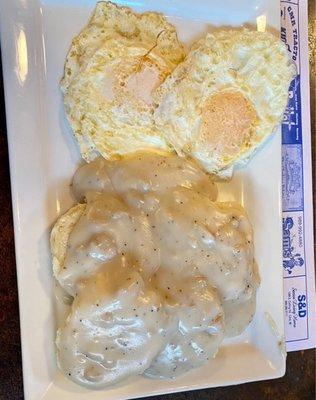 Eggs over easy with biscuits and gravy