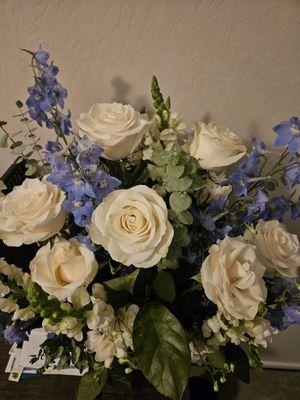 Close up of the beautiful roses and forget-me-nots two days after being delivered