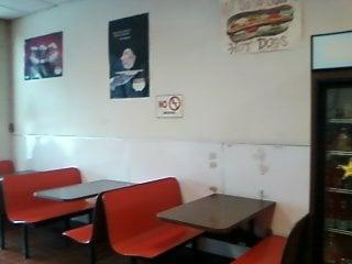 a nice little dining area where you can enjoy your coffee , donut or sandwich